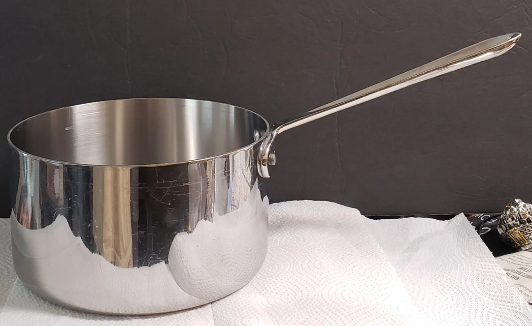 The All-Clad D3 Stainless Steel 1 Qt Covered Saucepan: A Compact Culinary Powerhouse